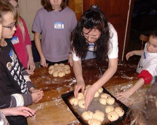 Esther helping children
