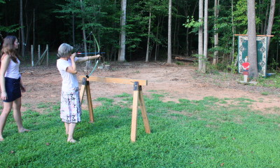 Becky shooting bow & arrow